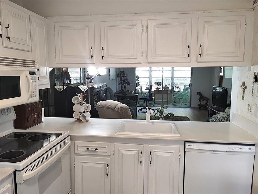 CHARMING 1ST FL GARDEN UNIT IN PRISTINE CONDITION! FULL HURRICANE PROTECTION. LARGE WOOD PLANK WATERPROOF LAMINATE FLOORS CREATES A WARM ATMOSHERE. TEXTURED KNOCKDOWN WALLS. EAT-IN KITCHEN OPEN TO THE DINING/LIVINGROOM. APPLIANCES 2021! BATHROOM VANITES & TOILETS ARE UPDATED. ALL WINDOWS HAVE 2" WHITE BLINDS. THE INVITING PATIO IS ENCLOSED & SURROUNDED BY PEACEFUL GREENERY. LOW MAINTNENCE MAKES THIS EVEN MORE DESIREABLE! WYNMOOR LIFESTYLE INCLUDES SWIMMING, DANCING, SINGING, BILLIARDS, BOCCE BALL, PICKLEBALL,TENNIS & GOLF AS WELL AS CLUBS & CLASSES GALORE, A THEATRE FOR MOVIES & LIVE SHOWS & A STATE OF THE ART FITNESS CENTER. FREE SHUTTLE BUSES ARE AVAILABLE TO TRAVEL IN & OUT OF THIS GATED COMMUNITY. WE HAVE A RESTAURANT & DR'S OFFICE ONSITE. TAKE ADVANTAGE OF THIS BUYERS MARKET NOW!