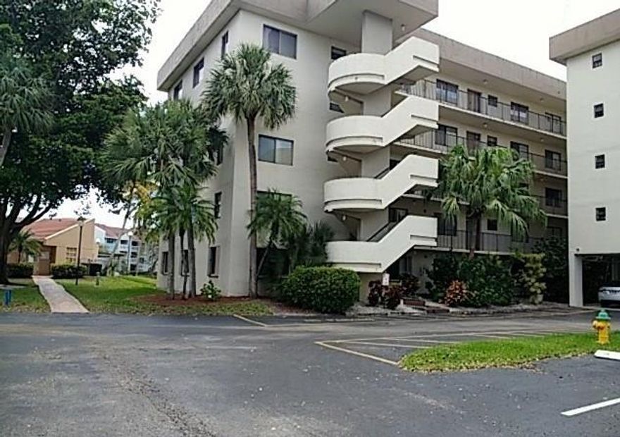 Specious, Corner unit, Three bedroom and two bathrooms with a lake and pool area view, hurricane shutters, eat in kitchen, over sized laundry room, located in gated community, near shopping, hospital, and highways.