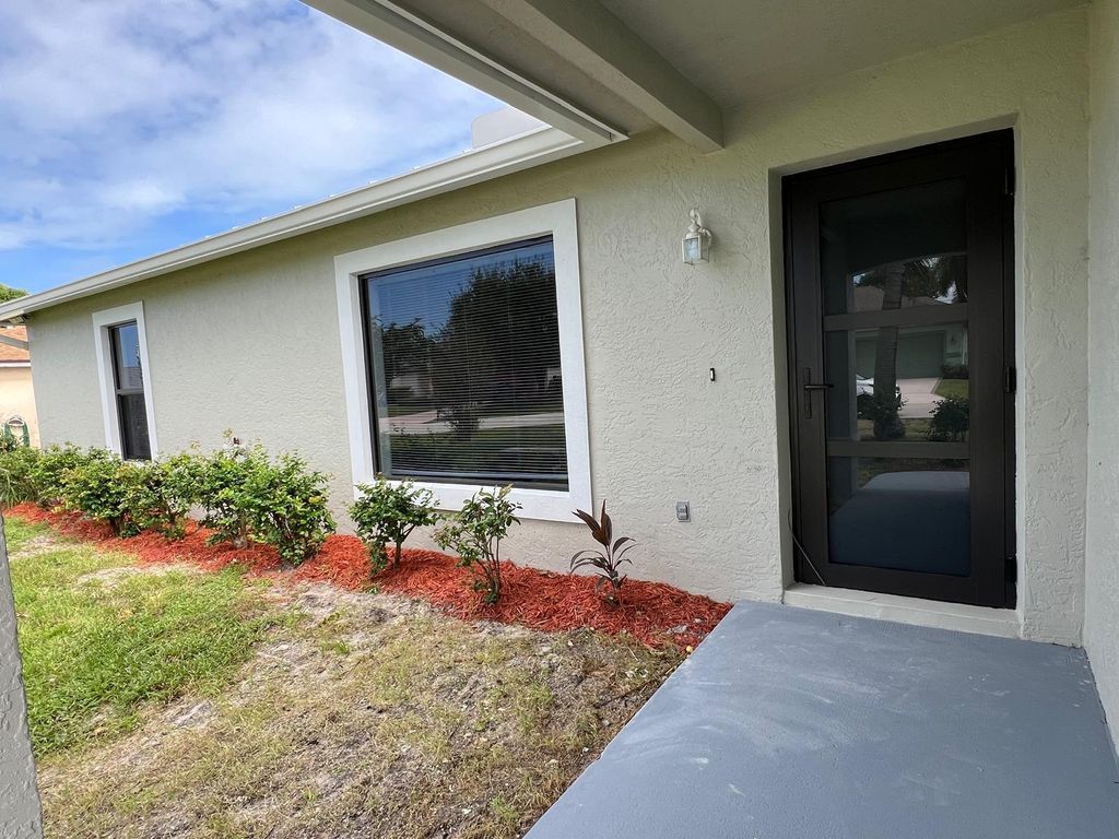 Photo of 2309 SE Rock Springs Drive, Port Saint Lucie, FL 34953 (MLS # R11020546)