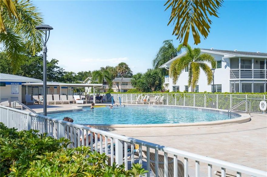 Enjoy your care-free and active 55+ lifestyle in Deerfield Beach! Well-priced corner unit in elevator building; Furnished, Tastefully appointed, Ceramic tile in main areas and laminate in bedrooms, Storage closet on large balcony. Contemporary furnishings. Steps away from laundry room & Storage closet, Easy walk to one of 17 pools, Massive clubhouse with great amenities, Classes, Social gatherings, Movies and shows, Fitness center, Golf, Tennis, Pickleball court. Easy step-in shower, Mirrored closet doors, Cordless blinds. Secure, Gated, Shuttle, Four miles to Beach.Computer desk and Rug, Art, and Mirror, TV and Stand & Beige bench on balcony do not convey.