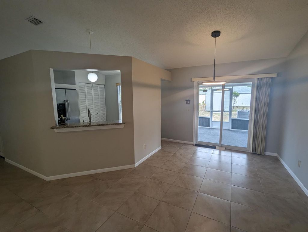 Photo of 622 SW Stillman Avenue, Port Saint Lucie, FL 34953 (MLS # R10995380)
