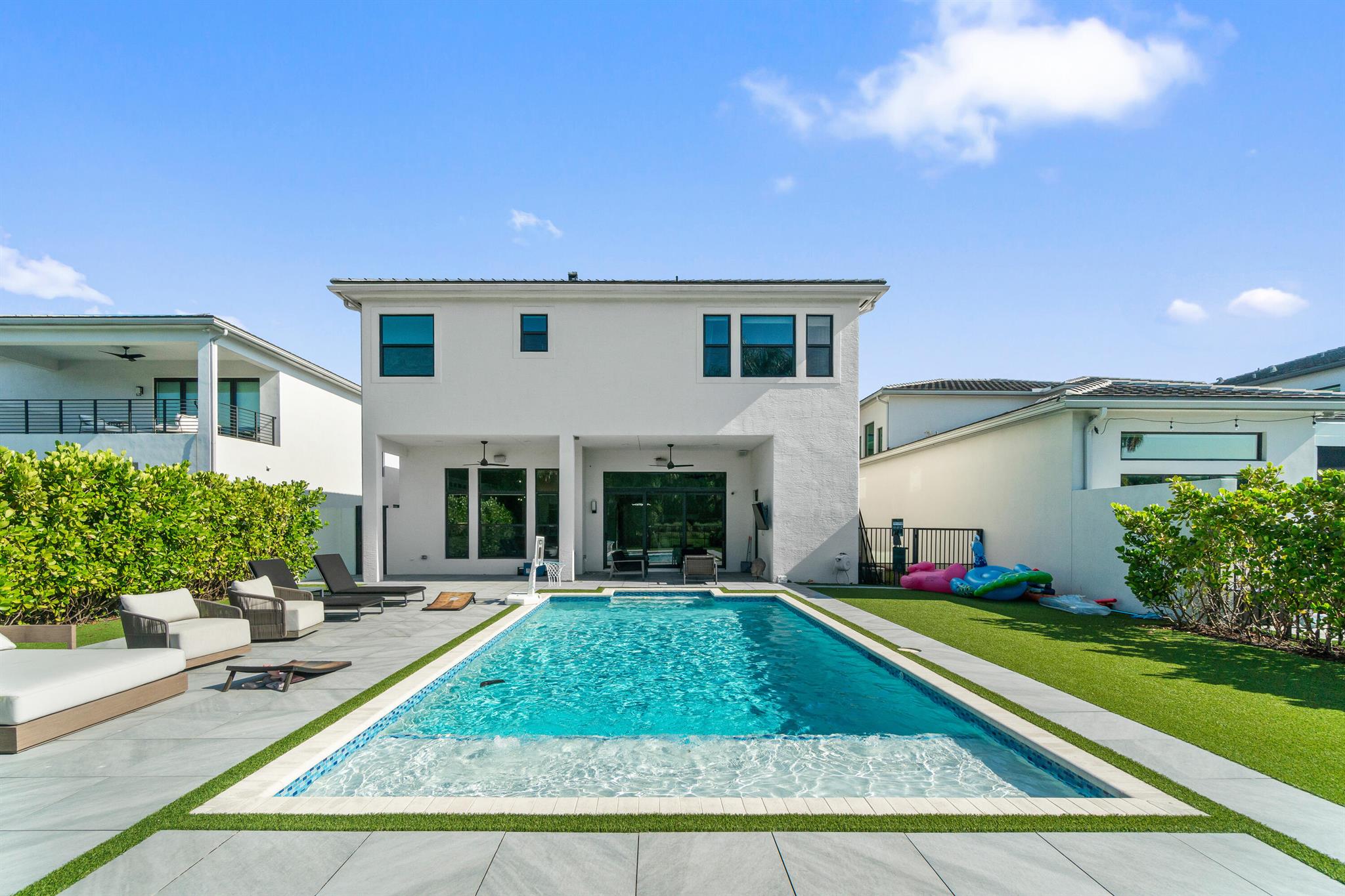 Set on one of the largest lots in Boca Bridges with no rear neighbors, this Sanibel model offers over 5,330 sq. ft. of luxury living with 5 ensuite bedrooms and 6.5 baths. This home features gorgeous porcelain accent wall, upgraded kitchen, google smart home, Lutron lighting Sonos, salt water pool, and much more!The Boca Bridges offers resort style amenities with no club dues: a 27,000 sf clubhouse, gourmet restaurant, pools, fitness center, tennis, pickleball, indoor/outdoor basketball, splash park and more!
