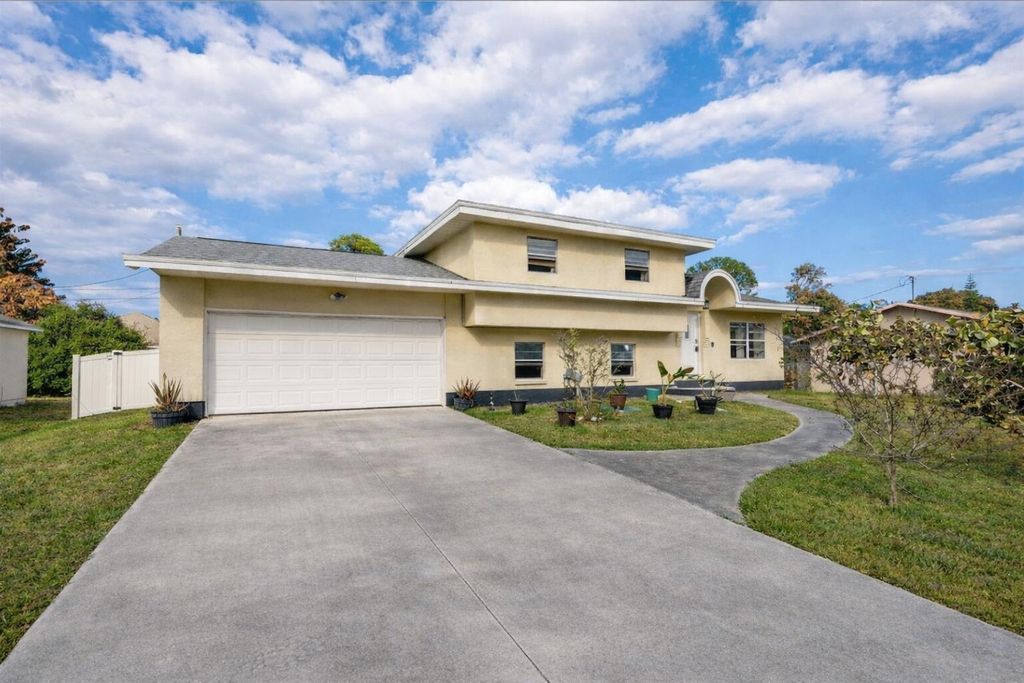 Photo of 517 NW Floresta Drive, Port Saint Lucie, FL 34983 (MLS # R11161341)