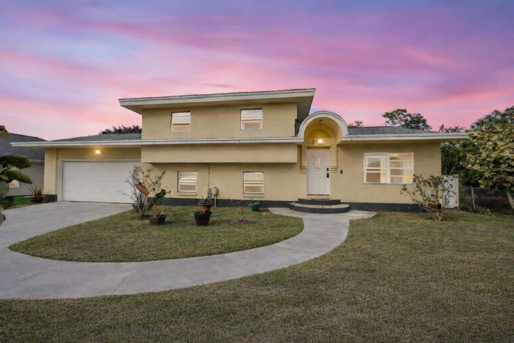 Photo of 517 NW Floresta Drive, Port Saint Lucie, FL 34983 (MLS # R11161341)