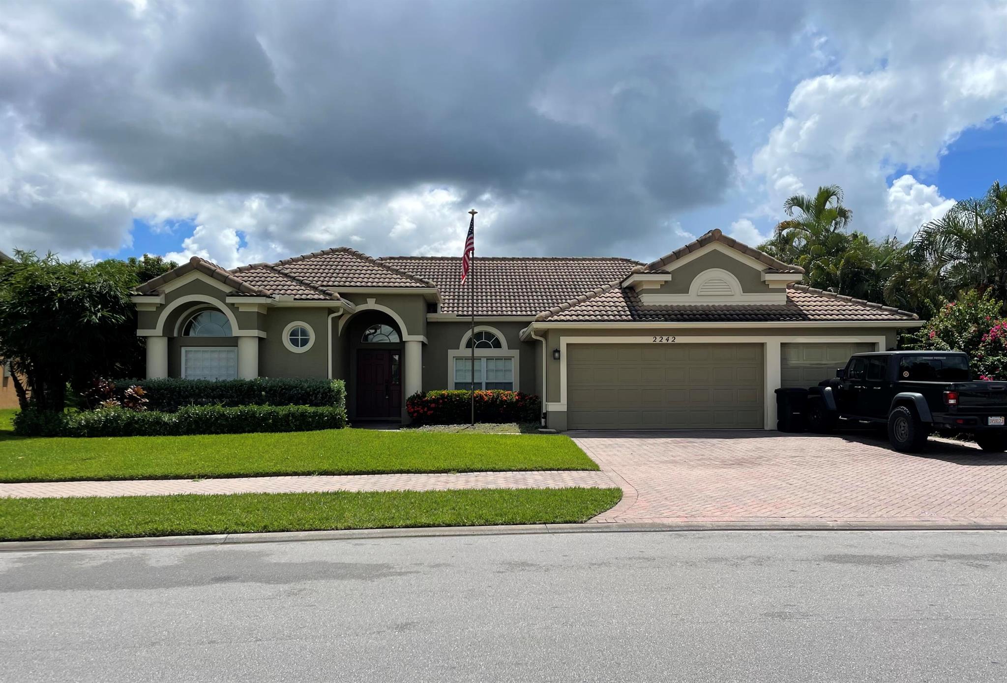 Welcome to 2242 SW Panther Trace - a spacious 4-bedroom, 3-bathroom, 3-car garage home offering almost 2500 sq ft of comfortable living in the heart of Stuart. Move-in ready with an air conditioner that's just 5 years old, hurricane impact-rated windows (all but a decorative one in the bathroom), a whole-home A/C filtration system, a hookup for a generator, and an existing service warranty. This home is designed for both convenience and peace of mind. The kitchen is a chef's delight with granite countertops, a dedicated pantry, and newer appliances. The open and inviting floor plan provides plenty of space for entertaining or relaxing, while the generously sized bedrooms offer comfort for family, guests, or a home office.This home is the perfect blend of modern comfort and