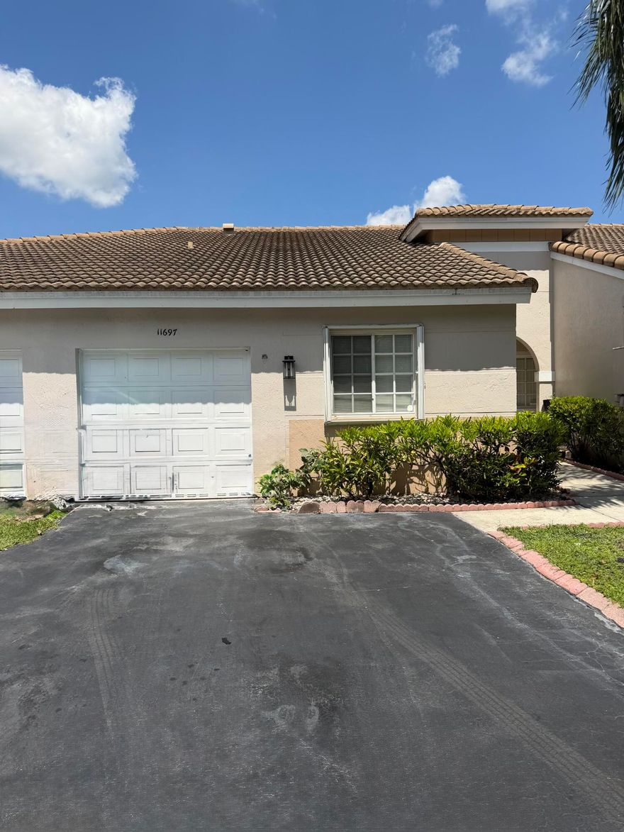 Rarely available and beautifully updated villa located in the Manors @ Villages of Renaissance. This one story villa features 2 bed/1 bath / 1 car garage on serene water views. Brand new bright and light kitchen and large updated bathroom. Kitchen features all  new cabinets and stainless steel appliances. Large updated bathroom, featuring 2 separate sinks and large shower.   Freshly painted interior . Walk in to a large living/ dining set up that over looks a lush backyard. Accordion Shutters. Located close to all major highways, shops