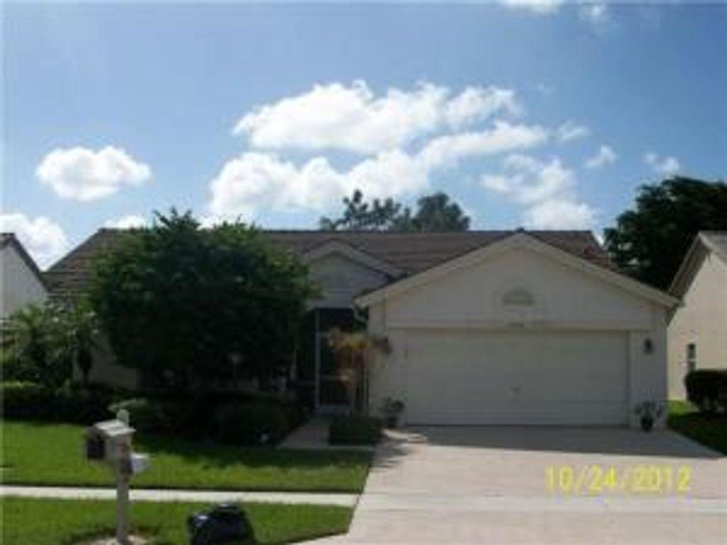 Photo of 8281 Lake Cypress Road, Lake Worth, FL 33467 (MLS # R10894151)