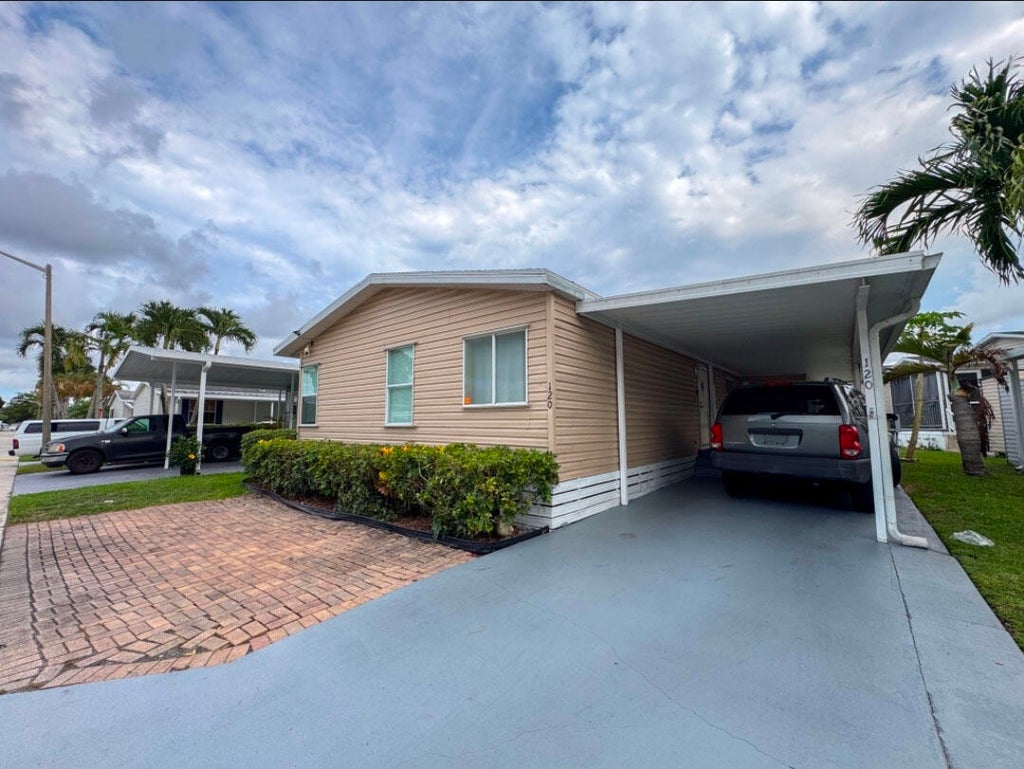 Photo of 120 Plantation Boulevard #120, Greenacres, FL 33467 (MLS # B26040555)
