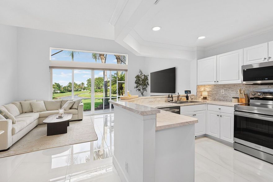 Beautifully updated and centrally located, this townhome offers the perfect blend of comfort and convenience. Featuring two spacious bedrooms, two and a half updated bathrooms and a modern kitchen with stainless steel appliances.  This home is move-in ready with stylish finishes throughout. Enjoy serene lake views that create a peaceful backdrop on your private screened in patio, while the flex loft space adds flexibility—ideal for a home office or additional living space. Situated in a prime location close to shopping, dining, and major roadways, this home delivers both lifestyle and accessibility. Also available fully furnished.
