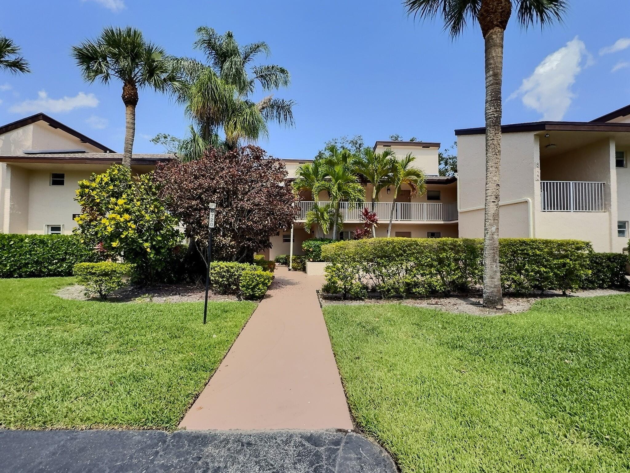 SELLER CONCESSION TOWARD BUYER'S CLOSING COSTS. New roof, concrete restoration, and paint completed. Fabulous Floorplan in this huge 2 bedroom 2 bath 1,300 SF Woodmont Country Club Condo in Tamarac, FL. Big beautiful trees and a lovely golf course view are there to enjoy from your oversize screened balcony. Inside enjoy huge closets, high ceilings, spacious kitchen and 2 NEW remodeled bathrooms with beautiful porcelain tile and wood vanities. NEW living room and bedroom weatherproof plank flooring. Azalea Court is close to everything with shopping, hospitals, schools, highways and restaurants just minutes away. 2 dogs allowed max 20 lbs each. no pit bulls in Tamarac. 10% down required. No leasing 1st year. All ages welcome.