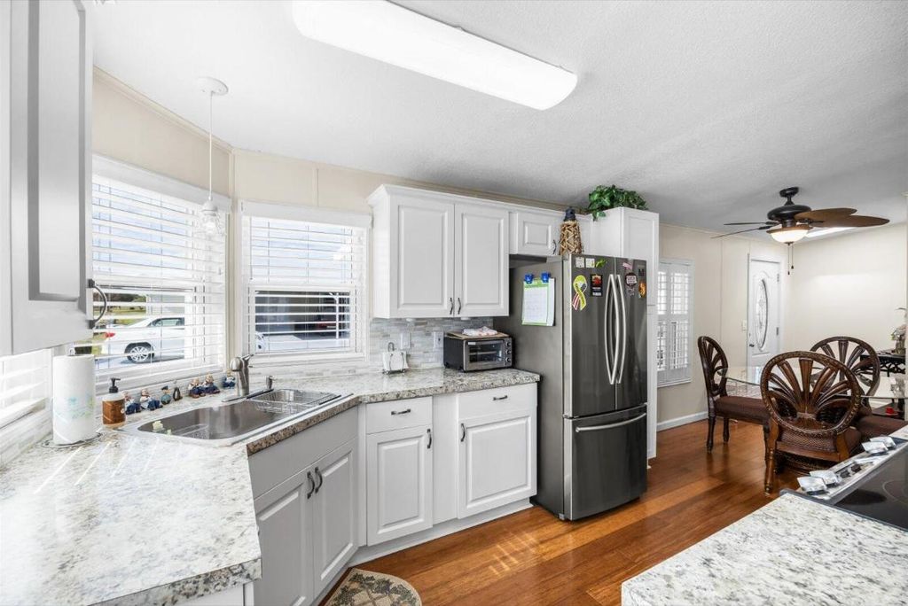 Photo of 3609 Pebble Beach Ln, Port Saint Lucie, FL 34952 (MLS # R11150766)