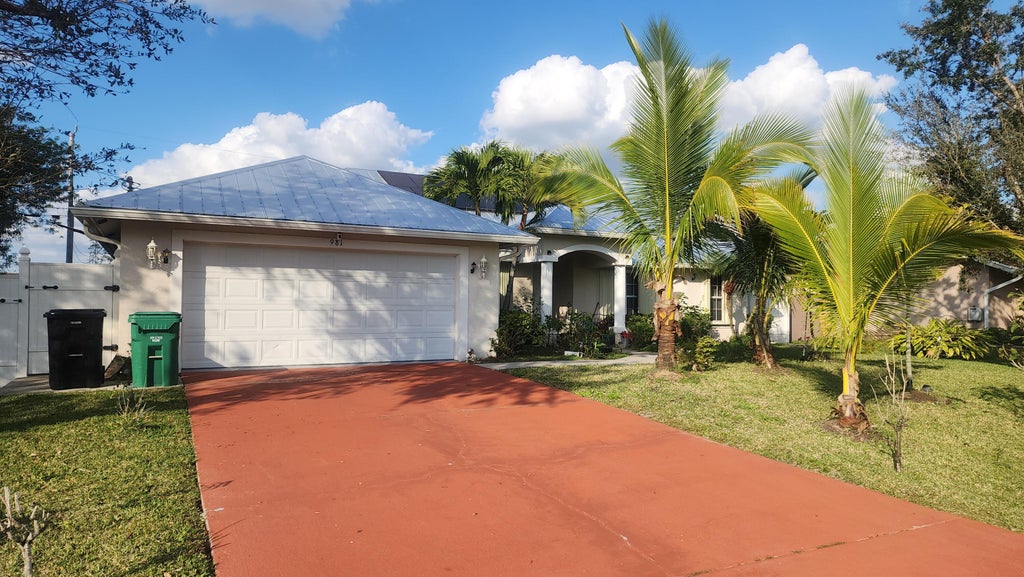 Photo of 981 SW McCracken Avenue, Port Saint Lucie, FL 34953 (MLS # B26066308)