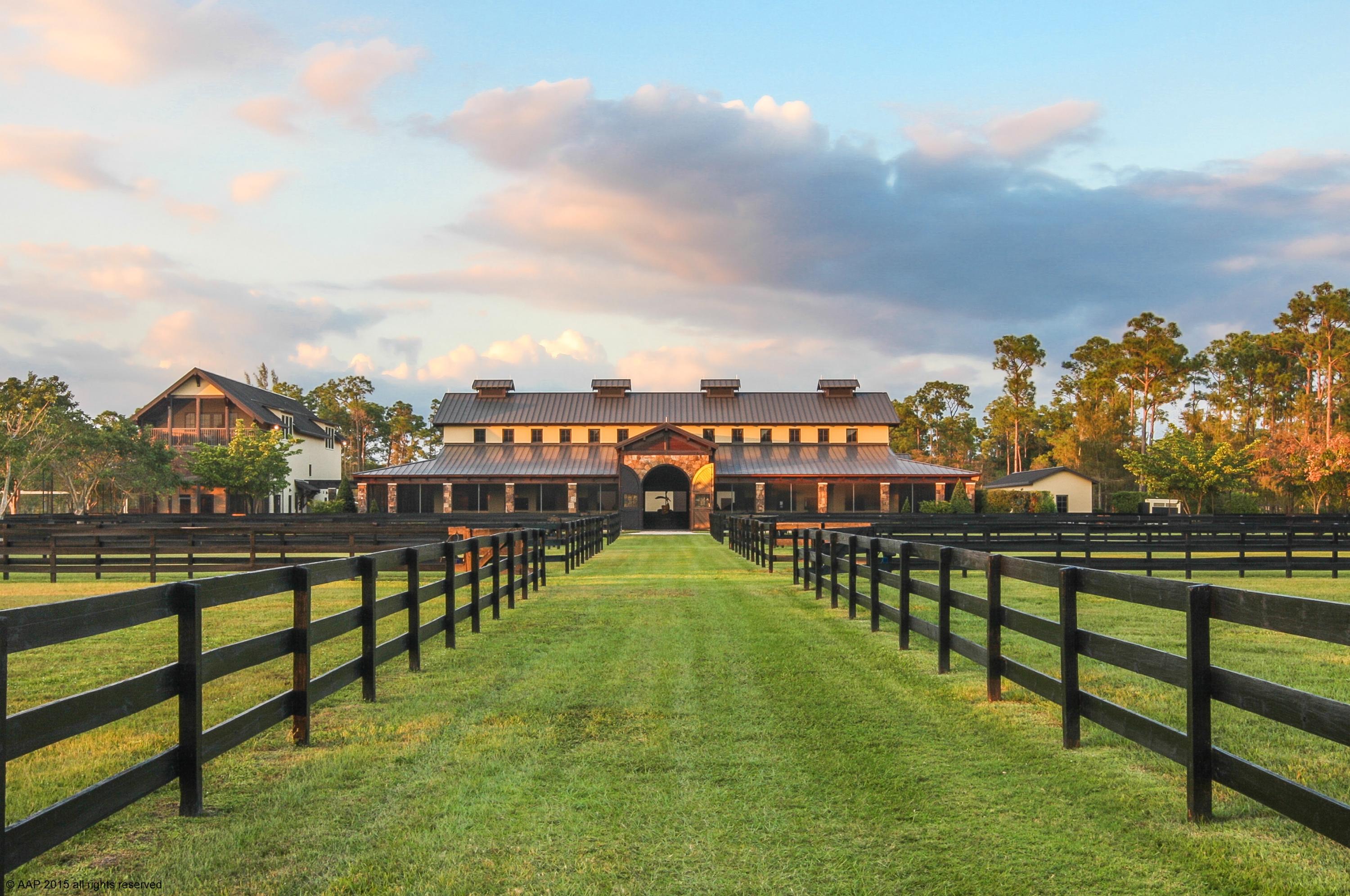 Private 15 acre custom designed home with top equestrian facilities. Unmatched in quality, design & finishes, probably one of the areas finest built properties. Every detail was meticulously considered. Stunning stable with exposed wood beam trusses, 3 grooming bays, wash & storage areas. Riding arena with underground watering system, hot walker and round pen. Beautifully landscaped with private hacking paths throughout which complement the subdivision's trail system. Three grooms apartments and separate ancillary buildings with veterinary / farrier rooms, feed storage and multiple equipment bays. The main residence features cathedral ceilings, fireplace with floor to ceiling stone chimney, wood & marble floors, elevator, a screened balcony and infinity pool with private water vistas.