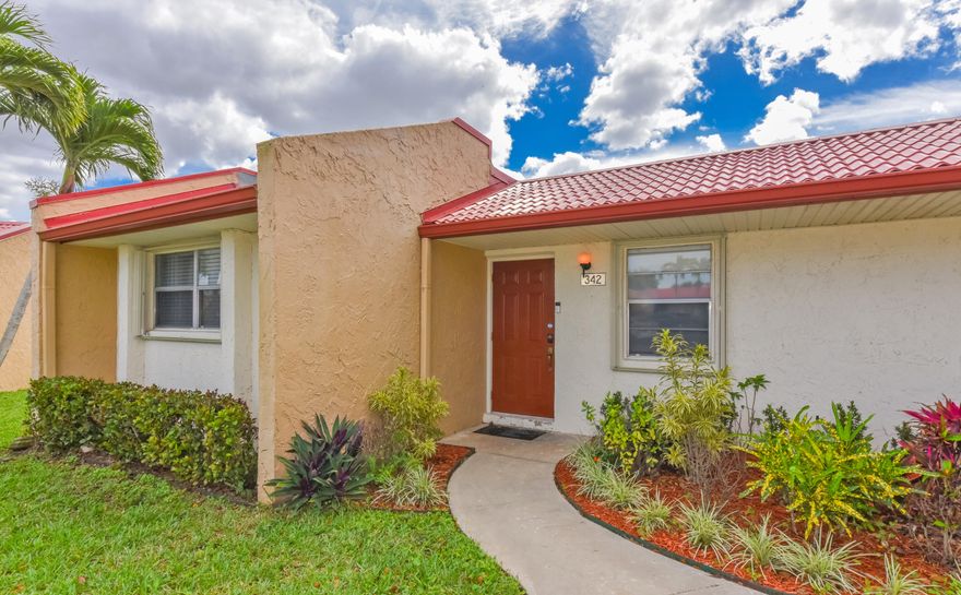 Adorable waterfront villa filled with natural light! This inviting home features an updated kitchen with a beautiful granite countertop that opens seamlessly to the living area—perfect for everyday living and entertaining. The interior boasts ceramic plank flooring throughout and two modern walk-in showers for added comfort and style. Start your mornings with coffee or unwind in the evening on the screened patio, where you can enjoy serene, wide lake views. A charming retreat with relaxing waterfront scenery!
