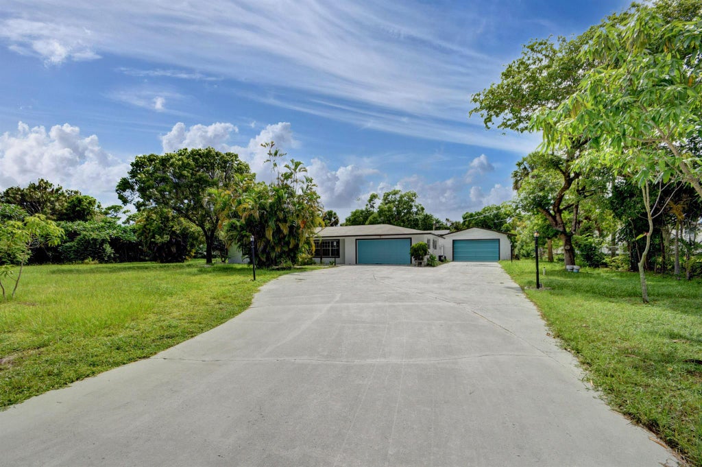Photo of 1321 Ranchette Road, Greenacres, FL 33415 (MLS # R10927429)
