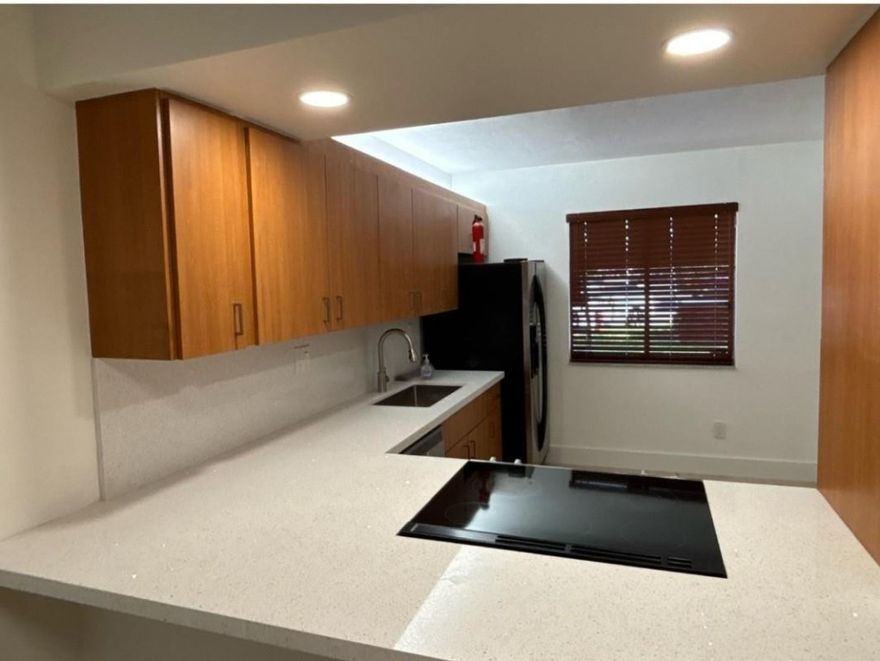 Great for investors, New Homebuyers.  Can be rented right away. This beautifully renovated 2-bedroom, 2-bath condo in the desirable Racquet Club Apartments of Weston. This bright and spacious unit features an updated kitchen, and baths, durable vinyl flooring throughout, full size washer/ dryer, corner lot with back enclosed porch and water-view. Conveniently located near A+ schools, safe and secure environment with easy access to great shops and restaurants.