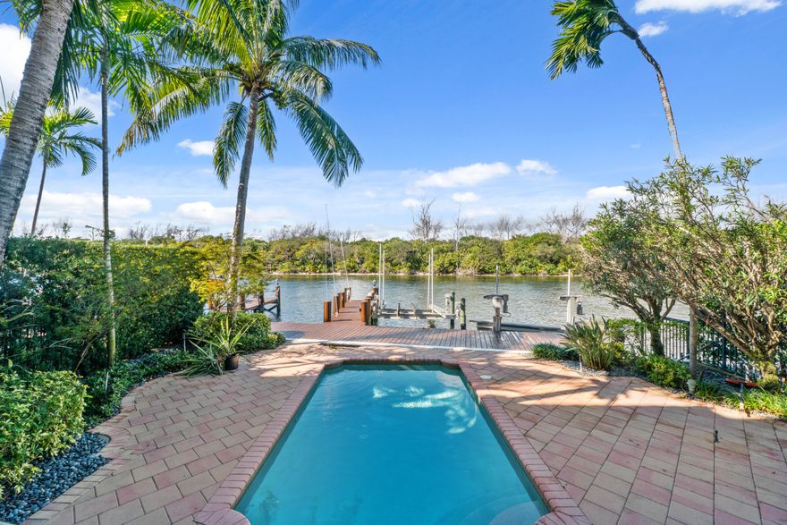 Deerfield Beach Townhomes, 4125 sq. ft on the intercoastal with views of Al Capone Island tranquil nature preserve and a short walk to the beach, restaurants and shops. This incredibly detailed home features incredible water views, private dock with 2 lifts. 34ft vessel plus a separate lift ideal for two personal watercraft or 13 ft tender. Saturnia marble floors, elevator, fireplace, custom wood cabinetry, crown moldings, impact glass and doors, Miele, Wolf and sub-zero appliances, Game room/theater, lush landscaping heated pool and barbeque area, large patio/entertainment area running along the north side of property that no other units have. 2 car garage with 5 dedicated additional parking spaces. extra storage in garage, property is adjacent to a. small park. COMMANDING DIRECT INTERCOASTAL VIEWS WITH UNPARRELLED PRIVACY.THIS EXCEPTIONAL WATERFRONT PROPERTY DELIVERS A RARE BLEND OF PRIVACY, LUXURY AND PREMIER BOATING LIFESTYLE. DESIGNED FOR EFFORTLESS COASTAL LIVING, THE PROPERTY FEATURES A PRIVATE ELEVATOR AND AN UNPARRELLELED MARINA STYLE SETUP.ACCESS IS MINUTES AWAY FROM BOTH BOCA AND HILLSBORO INLETS.EXPANSIVE WATER VIEWS CREATE A STUNNING BACKDROP FOR DAILY LIVING, ELEGANT ENTERTAINING, BEAUTIFUL SUNSETS WHILE THE HOME'S QUIET, EXCLUSIVE SETTING PLACES YOU JUST MINUTES FROM THE BEACH, DINING, AND UPSCALE AMENITIES . COMPLETING THIS RARE OFFERING IS PARKING FOR 5 VEHICLES PLUS A TWO CAR GARAGE, MAKING IT AS PRACTICAL AS IT IS PRESTIGIOUS. A TRULY DISTINGUISHED INTERCOASTAL ESTATE FOR THE MOST DISCERNING BUYER. THIS HOME IS READY FOR YOU TO ADD YOUR OWN PERSONAL TOUCH .