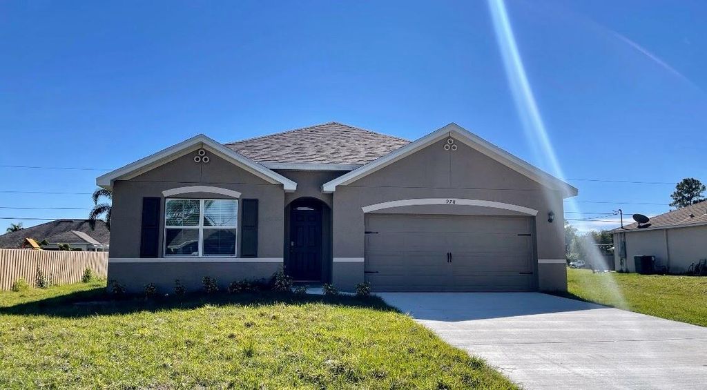 Photo of 978 SW Longfellow Road, Port St Lucie, FL 34953 (MLS # R11114888)