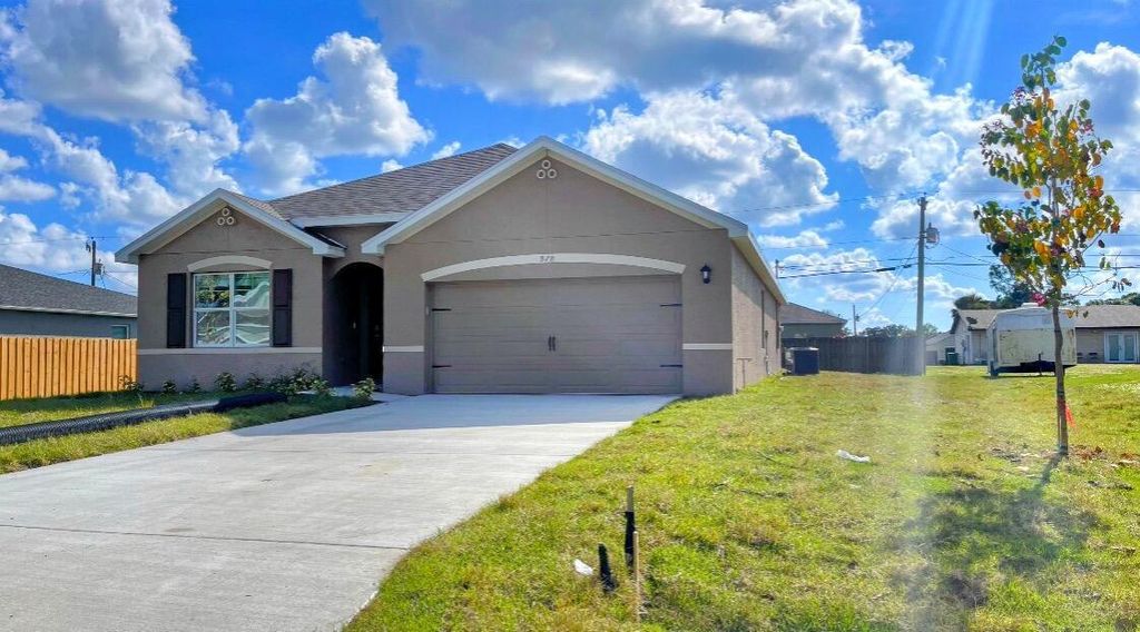 Photo of 978 SW Longfellow Road, Port St Lucie, FL 34953 (MLS # R11114888)