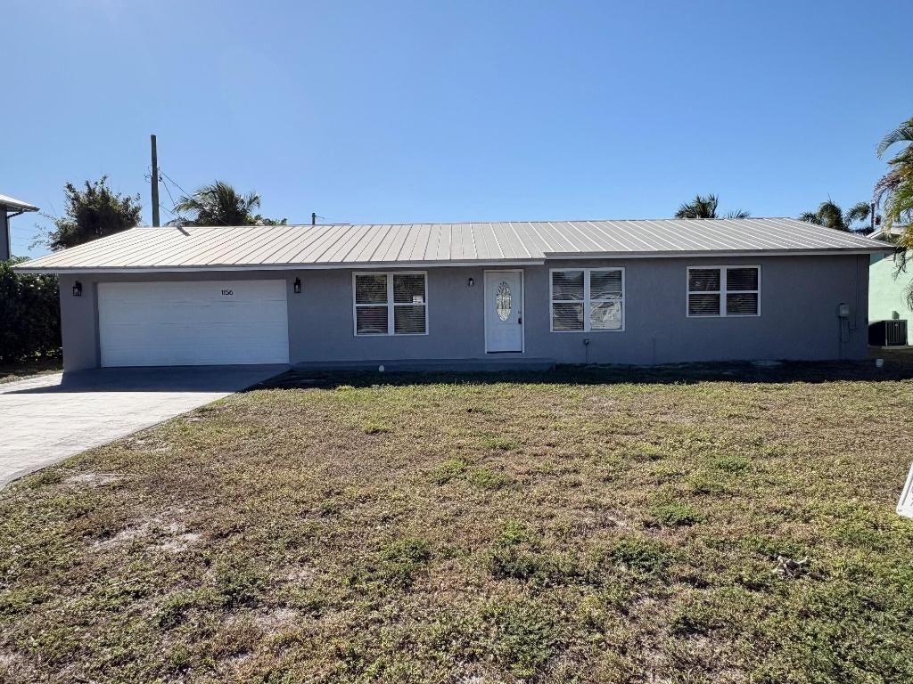 Photo of 1156 NE Terrace Way, Jensen Beach, FL 34957 (MLS # R11151600)