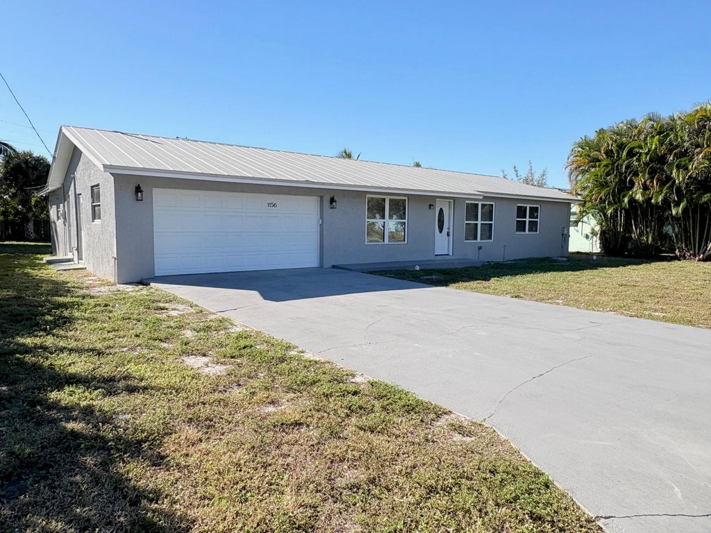 Photo of 1156 NE Terrace Way, Jensen Beach, FL 34957 (MLS # R11151600)