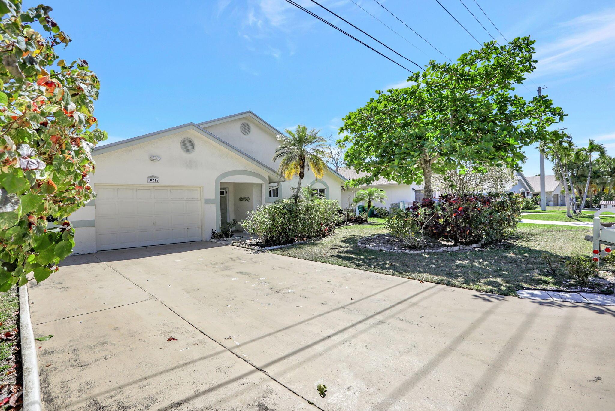 Welcome to Paradise! You CAN Have It ALL! Spacious Single Family Home in Active 55+ Community, Renovated from top to bottom. Enjoy Your Modern Designer Kitchen w/Your Peaceful Lake View. This beautiful home boasts classy tile floors throughout, no popcorn ceilings, 2 spacious bedrooms, & modern bathrooms. Enjoy Your Spacious Primary Ensuite, w/large walk-in closet, separate shower, & impressive view of the lanai & the tranquil lake. Relax in Your Private Lanai, & take in the Tranquil Long Lake View. Live the Florida Lifestyle that You have Dreamed of, w/Low HOA Fees & Community Amenities, including Resort Style Pool, Clubhouse, Tennis Courts & more. Close to world-class shopping & restaurants. Motivated Seller wants to help you make Isles of Tamarac Your New Home!