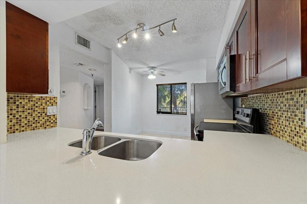 Photo of 2200 S Cypress Bend Drive #306, Pompano Beach, FL 33069 (MLS # F10492604)