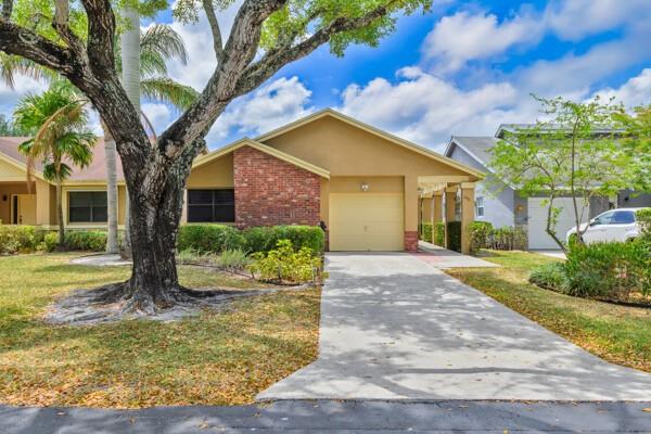 This detached single-family home is located in the desirable Tamarind Village, part of the Township. The community offers extensive amenities, including a gym, pickleball courts, tennis courts, a pool, a theater, and recreational rooms, among many others. It is an exclusive 55+ community with only 177 homes, featuring low HOA fees that cover cable, exterior painting, lawn maintenance, irrigation, and access to a heated pool and clubhouse. Waterfront home includes three bedrooms and two bathrooms, one car garage, enclosed patio, updated kitchen, and ceramic tile flooring. No rentals and no occupants under 18 are allowed. Roof - 2017; A/C - 2014; Tankless water heater. Visit this community, and you’re sure to fall in love!