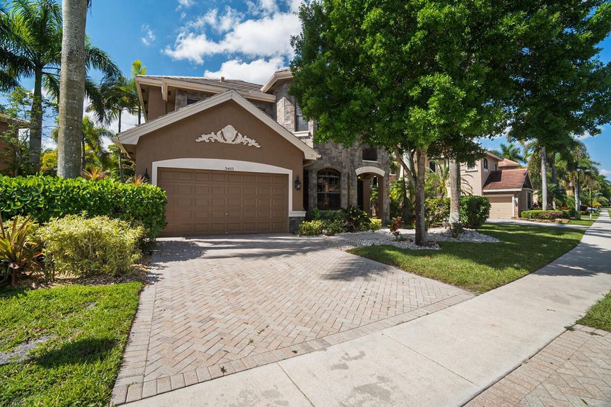 This beautifully designed home in the exclusive, gated Versailles community is now available for sale. This home is perfect for large families or anyone looking for comfort, space, and style in one of Wellington's most sought-after neighborhoods. Inside, you'll find five generously sized bedrooms, plus a den and a dedicated office, offering plenty of room for both living and working. The layout is thoughtful and functional, with the primary suite privately located on the first floor. The kitchen offers a gas stove, double oven, new refrigerator, and custom cabinetry topped with granite. A tumbled marble backsplash and stainless steel appliances tie everything together with a warm, modern finish.  The primary suite offers tranquil lake and pool views, a large en-suite bathroom with dual vanities, walk-in shower, and a romaine tub.  This beautifully landscaped home comes equipped with a heated pool overlooking the lake. Perfect for relaxing or entertaining outdoors year-round.  Life in Versailles means access to top-notch amenities: a resort-style pool and spa, full gym, tennis and basketball courts, clubhouse, and playground. It's all just minutes from world-class equestrian events.  This home offers more than just square footage, it's a lifestyle opportunity, in a location that keeps you connected while offering space to unwind.  Don't miss the opportunity to experience this spacious and elegant home. Schedule a private showing today and see all that this property and community have to offer.