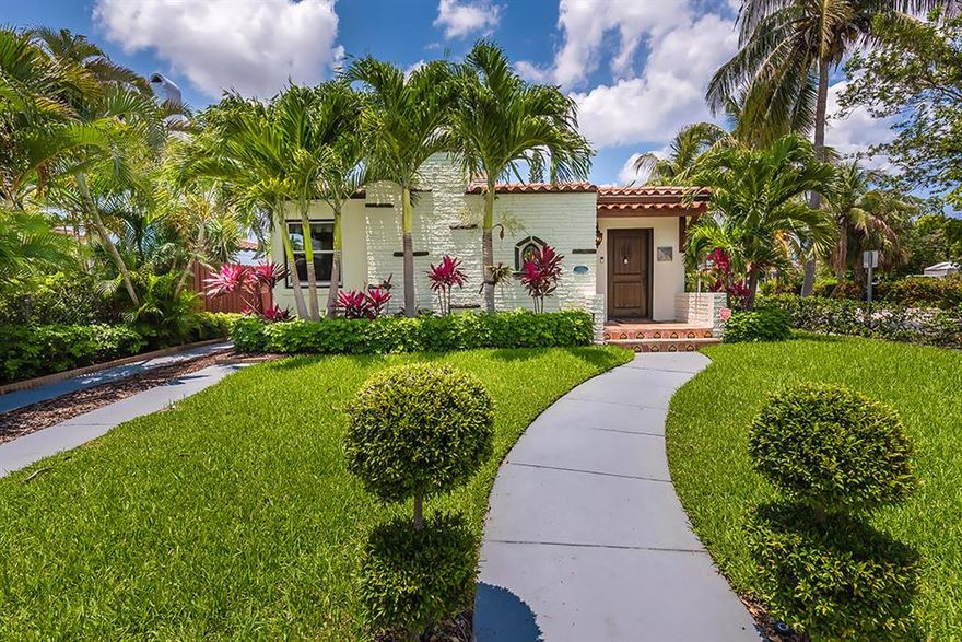 Your oasis awaits you in this Spanish style home with heated, salt water pool. Lush tropical landscaping adorns the wood door entry with ceramic tiles adding to the historic character. The open living and dining space is perfect for entertaining with gorgeous wood floors, updated fixtures, and decorative fireplace. The light and bright kitchen is fully equipped with stainless steel appliances, quartz countertops, clean modern cabinets, and custom tile backsplash. The master suite with updated bathroom features a private french door exit poolside. Don't miss the grilling and backyard bar pagoda. This perfect paradise awaits you steps from the Intracoastal waters and minutes to downtown West Palm Beach. Be a part of the Northwood community and it's candlelit historic home tours.