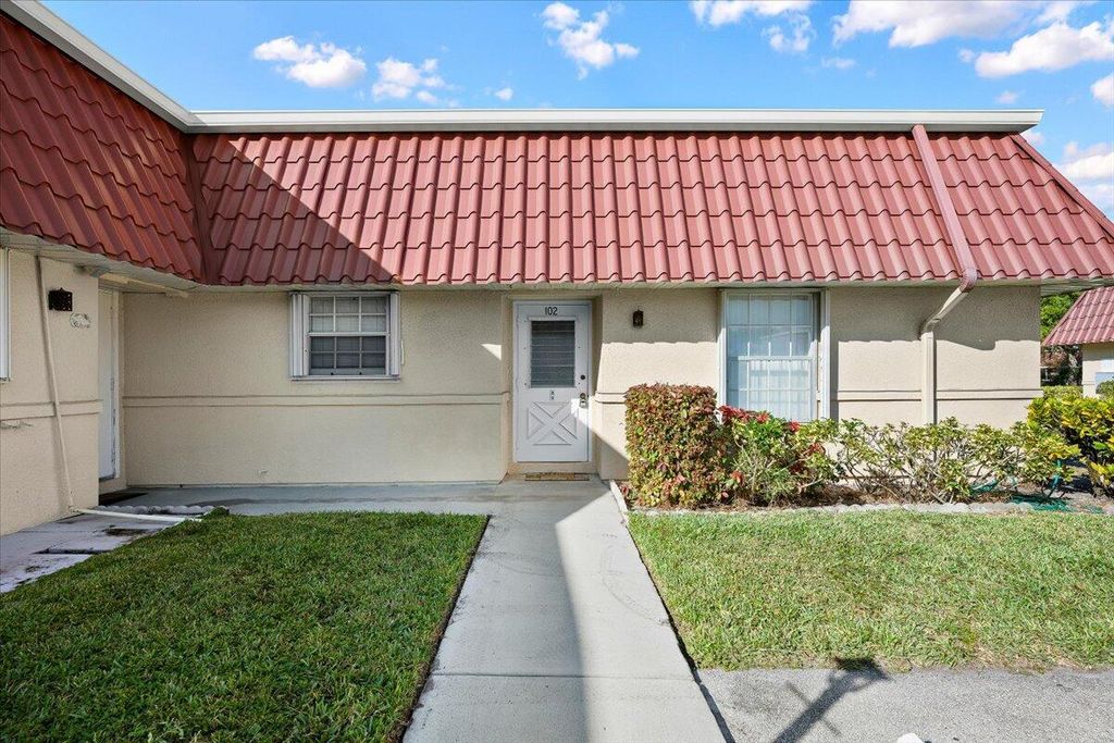 Photo of 102 Amherst Lane, Greenacres, FL 33467 (MLS # B26017233)