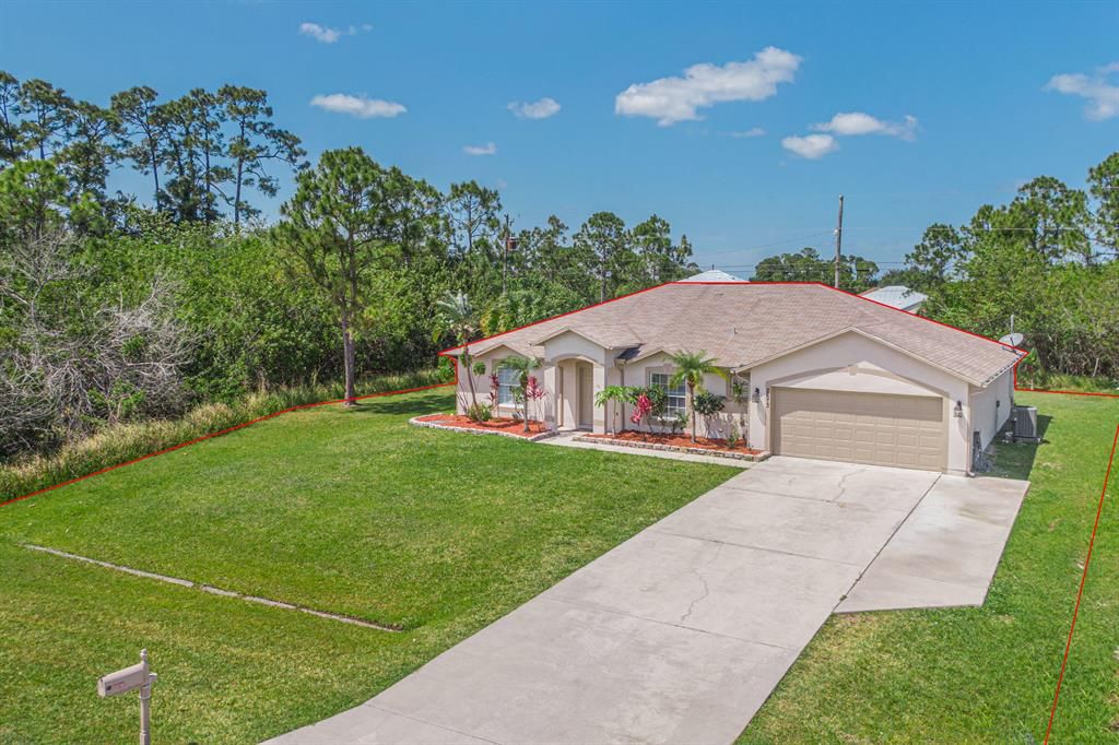 Photo of 2673 SW Import Drive, Port Saint Lucie, FL 34987 (MLS # R10710412)
