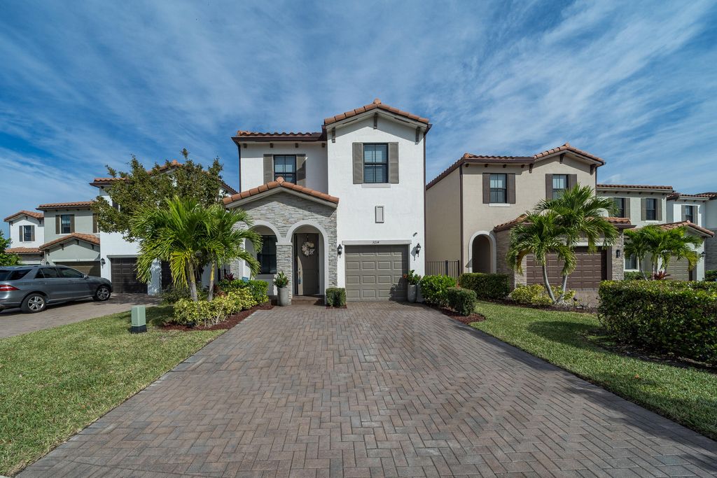 Photo of 3014 Butternut Lane, Riviera Beach, FL 33410 (MLS # R10851456)