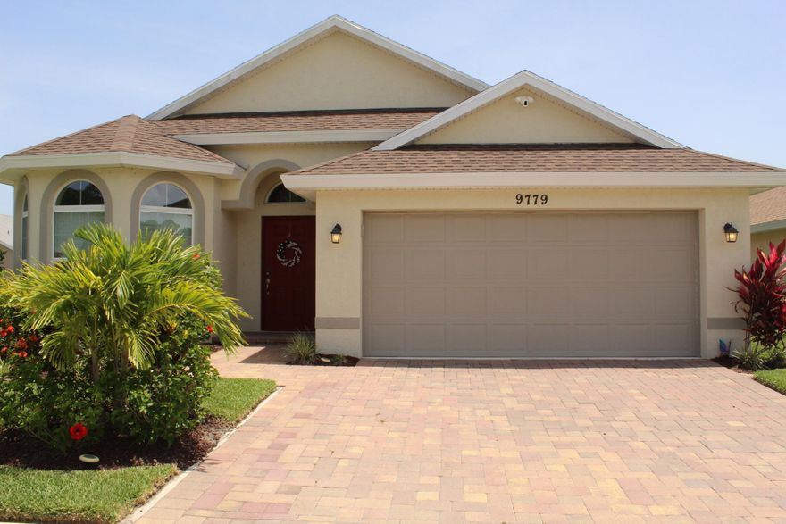 New construction without the wait! Built in 2020 do not miss this nicely updated 3/2/2 CBS single family home in desirable Palm Breezes community. Home features newer CBS construction, 3 bedrooms, 2 full bathrooms, 2 car garage, open split floor plan, volume & tray ceilings, quartz kitchen counters, 42'' kitchen cabinets, stainless appliances, plantation shutters, updated fixtures, his & her walk-in closets, oversized frameless shower, screened lanai with brick pavers, zoned irrigation, fully fenced private back yard, and so much more. HOA community has pool, fitness room, & playground. Conveniently located to I95, FL turnpike, restaurants, shopping, hospitals & schools. Come and see for yourself. Community website www.palmbreezespoa.com