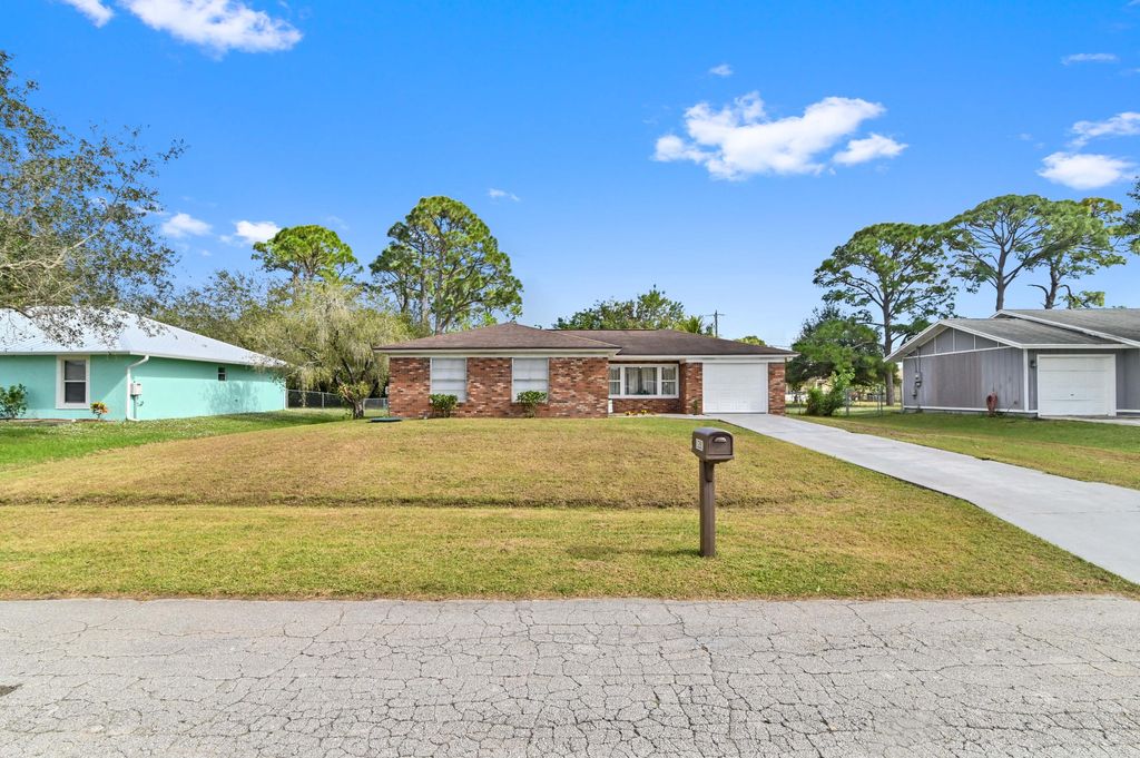 Photo of 1281 SE Navajo Lane, Port Saint Lucie, FL 34983 (MLS # R10938753)