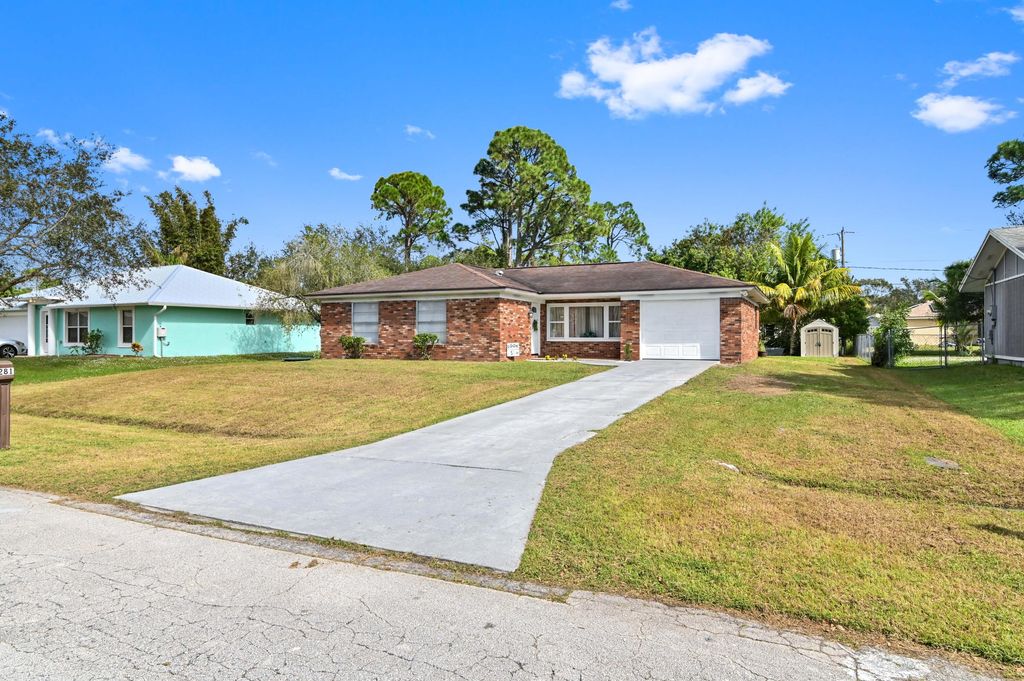 Photo of 1281 SE Navajo Lane, Port Saint Lucie, FL 34983 (MLS # R10938753)