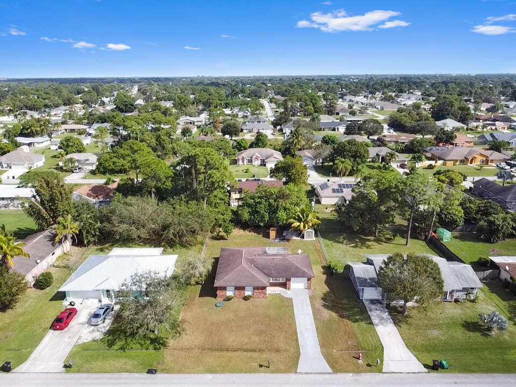 Photo of 1281 SE Navajo Lane, Port Saint Lucie, FL 34983 (MLS # R10938753)