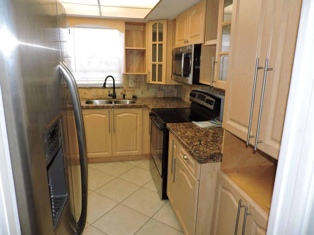 Photo of 5520 Tamberlane Circle #107, Palm Beach Gardens, FL 33418 (MLS # R10940315)