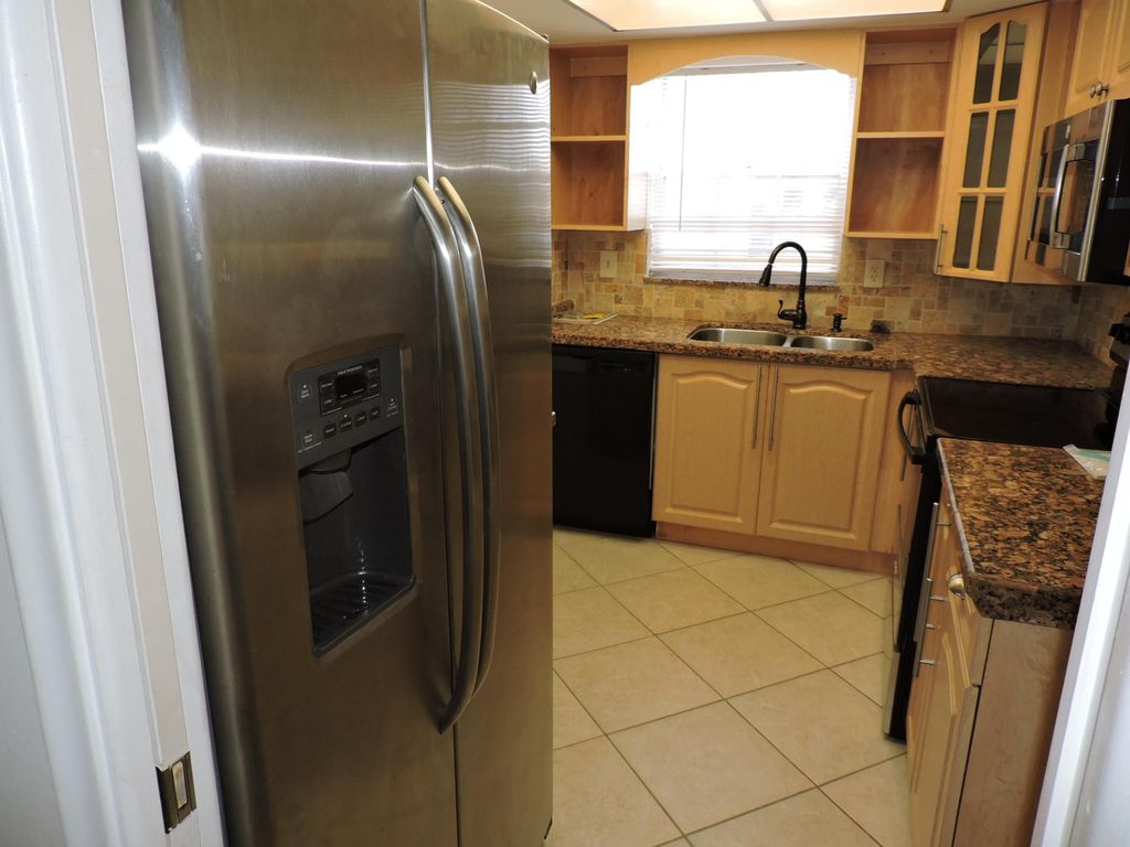 Photo of 5520 Tamberlane Circle #107, Palm Beach Gardens, FL 33418 (MLS # R10940315)