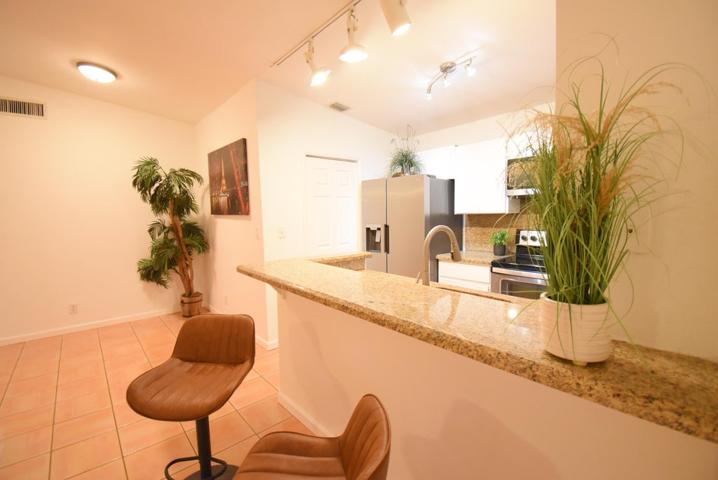 Photo of 11667 Timbers Way, Boca Raton, FL 33428 (MLS # B26065647)