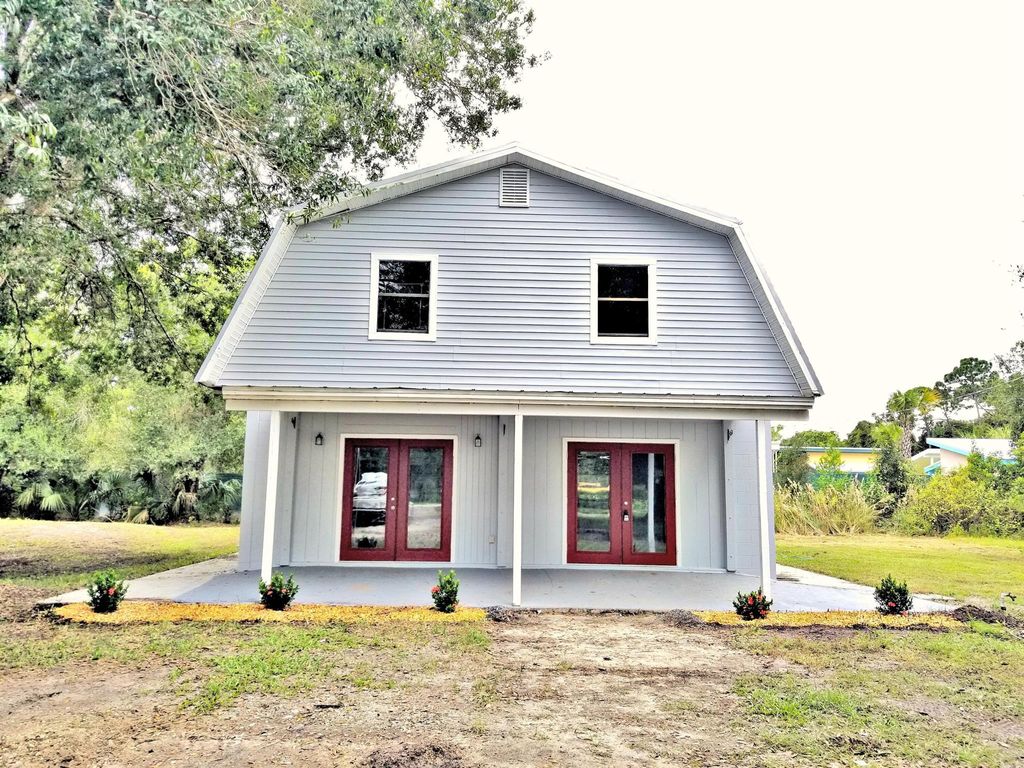 Photo of 3876 Devine Road, Fort Pierce, FL 34981 (MLS # R10999042)