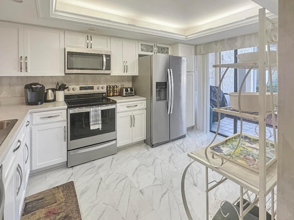 Photo of 3300 Twin Lakes Terrace #103, Fort Pierce, FL 34951 (MLS # R11156716)