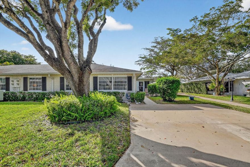 Beautifully updated villa in the desirable 55+ Limetree community, offering comfortable, low-maintenance South Florida living. Thoughtfully renovated with wood-look tile flooring throughout and an open, easy-living floor plan ideal for everyday enjoyment. The kitchen features wood cabinetry, granite countertops, upgraded appliances, and a glass tile backsplash. Spa-inspired bathrooms include designer tile finishes. Enjoy a peaceful, landscaped patio perfect for relaxing and enjoying your morning coffee or evening night-cap. This home has been impeccably maintained. Come experience care-free living and lifestyle.