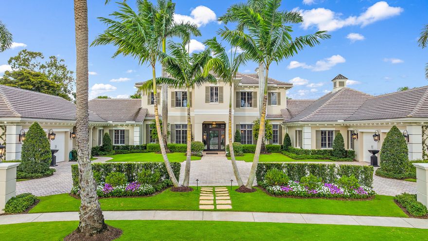 Magnificent custom estate on .71-Acre lot in the award-winning Club at Ibis. This one-of-a-kind property is located in Ibis's prestigious Eagle Isle neighborhood and boasts sweeping views of the 12th hole of the Jack Nicklaus-designed Legend Course.. This estate is impressive—both from a distance, and up close. The reimagined exterior and landscaping creates world class curb appeal. As you enter and explore the home, you will be impressed by fine craftsmanship and attention to detail. This estate was custom designed, masterfully built, and appointed with luxurious and classic interior finishes. Expertly refreshed with renovations in 2022 and 2023 and designed with warm traditional style, this grand estate is luxurious, comfortable and offers immense space and privacy. With more than 7000 upgraded square feet, this 5BR/5.2BA home envelops you from the moment you enter. Built by award-winning G.W. Purucker Homes, this estate features a 2017-installed roof, three 2016-installed and one 2023-installed AC units + double air-conditioned garages offering 4.5 spaces. Custom Anderson Impact windows and doors throughout, lightning protection and a new emergency generator which powers most of the house (replaced in 2023.) With classic design touches throughout, every nook of this home delights with high-end designer fixtures, exquisite window treatments, custom built-ins, quality moldings and millwork, custom lighting touches and timeless flooring (Saturnia marble and hickory wood through the main areas.) The entire interior of the home was repainted in 2022-2023 and included adding library paneling in the dining room and new custom wall unit in the family room. All new lighting fixtures have been installed through the home. The kitchen has been redesigned and includes double ovens, double dishwasher, two sinks with garbage disposals, a two-drawer refrigerator for additional refrigeration, and a warming drawer and microwave.  All kitchen appliances are new (2023) except the main subzero refrigerator.  In addition to the kitchen there is a wine room/butler's pantry with includes a subzero wine cooler, additional custom cabinets with sink with additional storage. The exterior of the home has been completed repainted with all lighting fixtures sand blasted and repainted including the upstairs second floor railing. The front landscape lighting has all been replaced. The landscaping in front has been completed replaced along with most of the back. The backyard was completely reimagined in 2023 with a new landscaping design, and a newly refinished pool with new pool tile. A new fountain was added along with artificial turf lining both sides of the pool to reduce maintenance. Enjoy the best of indoor/outdoor Florida living with (4) covered patio areas with (3) being screened.  The large patio off the living and dining room has retractable screens.  The summer kitchen and Cabana bath is off the family room and include a refrigerator, sink, storage, and a gas grill with hood to exhaust smoke. There is an air-conditioned storage room for pool supplies behind the summer kitchen.  The family room/breakfast room area of the house along with the guest TV room have hardwood floors.  Beautiful marble flooring in the main part of the house with French doors opening from the living room and dining room onto the patio.  The living room features built-in bookcases along with a gas fireplace.  The office has built-in custom cabinets, storage closet and a second closet with a safe along with French doors opening onto the back yard pool decking.  There are 5 full baths (with the primary having two water closets) and then 2 half-baths (one in the main hall and one off the outdoor kitchen which serves as the cabana bath). The recently refreshed primary bedroom suite offers a grand scale and features custom moldings, a sitting room, his and her closets with built in and a bath with two water closets one with a bidet, with a stand-alone steam shower and jacuzzi tub. The first-floor guest room area has two bedrooms with private baths, a sitting room with custom cabinets and a laundry room which includes a sink and a refrigerator.   The second floor has two bedrooms both with private bath, a sitting room, laundry closet and a coffee bar with sink and refrigerator and custom cabinets.  Both bedrooms have French doors which open onto the large patio overlooking the golf course with beautiful views. The upstairs porch overlooks the spectacular pool and spa area with vistas of 12th hole of the Jack Nicklaus-designed Legend Course. If you are looking for the highest level of quality, desire Ibis's active and award-winning lifestyle, there is simply nothing on the market or off the market--like it.