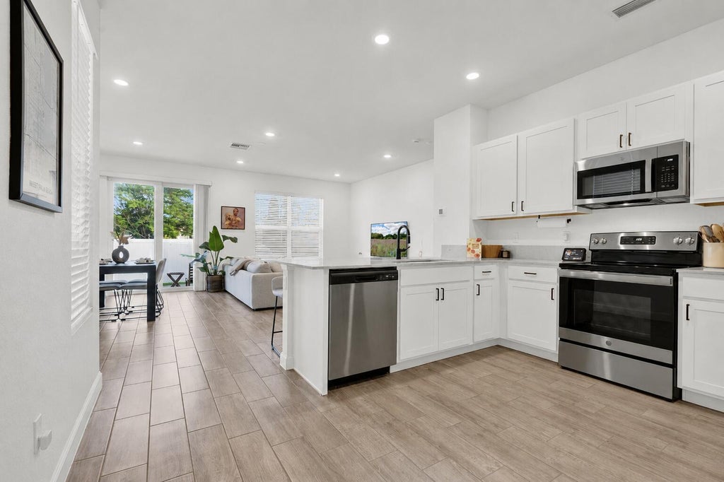 Photo of 4246 Lagoon Shore Drive, Greenacres, FL 33467 (MLS # B26042912)