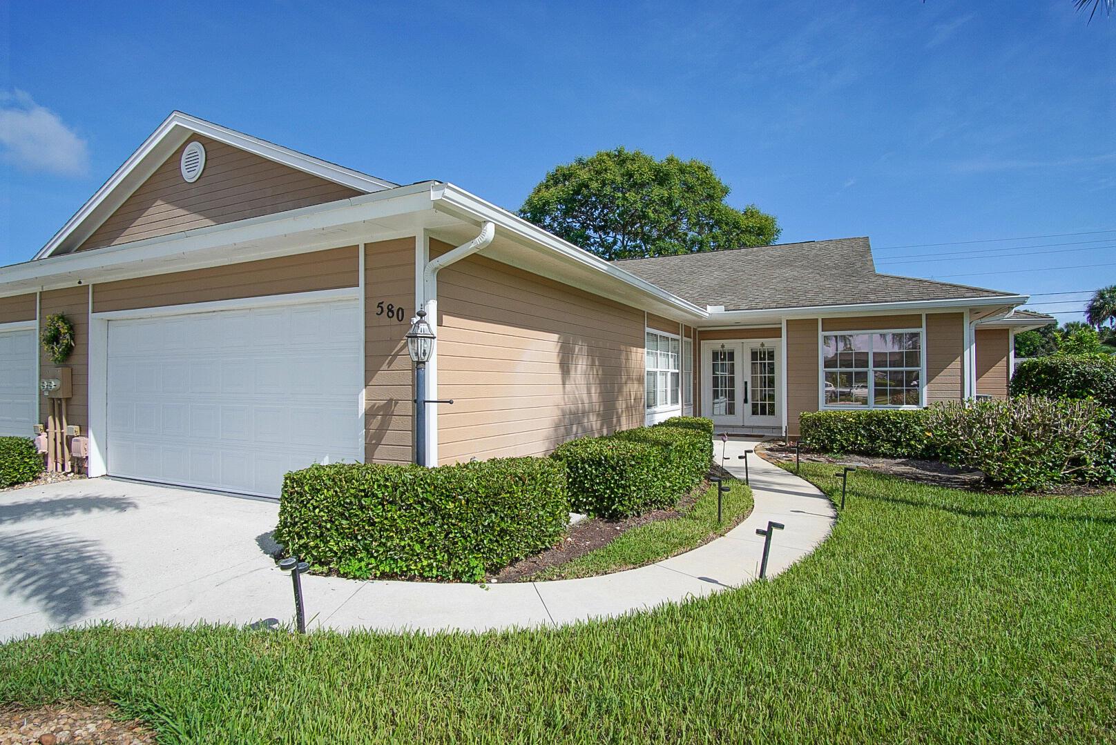 Absolutely gorgeous fully renovated villa. Low HOA. Walking into this stunner, the first thing you notice is the exlusive, White Oak, waterproof hardwood flooring throughout. Beautifully updated kitchen featuring Crystalli Quartzite countertops with waterfall edge and brand new Samsung appliances. Custom White Oak, ceiling height cabinets with soft close doors and drawers. These stunning cabinets extend through the open concept eat-in kitchen with dining space. A closet has been added to the flex room to create a third bedroom. Both bathrooms are brand new! Including, vanities, hardware, mirrors, tile, shower faucets, etc. Split bedroom design with screened lanai access from main bedroom, secondary bedroom, and living room. Highly desired neighborhood near Vero Beach Tennis/Fitness Club.