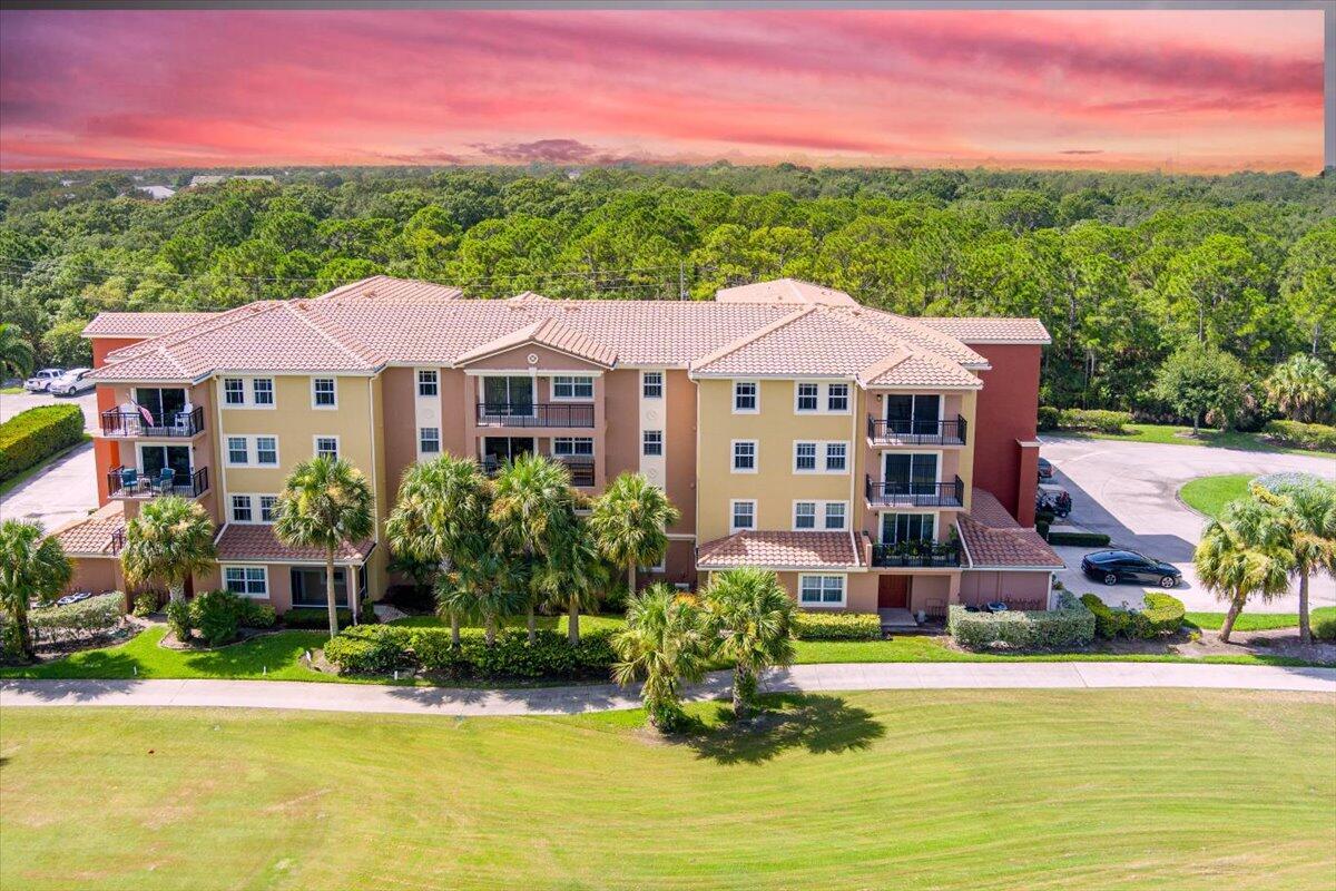 Very rare Penthouse Condo at Linkside at Gator Trace! Stunning 3-bedroom, 2.5 Bath penthouse on the 3rd hole of the Gator Trace Country Club. This is a private, back-corner unit with a serene lake and golf view! You will love the beautiful granite kitchen, stainless appliances, cathedral ceilings, ceramic tile floors, crown molding, and split bedroom floor plan. Move-in ready and pride of ownership shows! The building features impact-resistant storm windows, an elevator, covered walkways, and fire suppression systems. Enjoy your morning coffee on your private balcony overlooking the serene lake below. Inside laundry room with Washer & Dryer included! The unit features a one-car garage and provides space for a golf cart or additional storage. Gator Trace features manicured grounds, dining