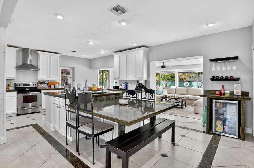 Beautiful 4 bedroom, 3 bathroom, two-story pool home perfectly situated on a corner lot in the highly desirable Cove neighborhood. Enjoy the coastal charm of being walking distance to Deerfield Beach. Featuring an open floor plan with a beautifully updated kitchen perfect for entertaining. New roof in 2022. No HOA, no restriction! Close to shops, dining, and the ocean. This is Florida living at it's best!