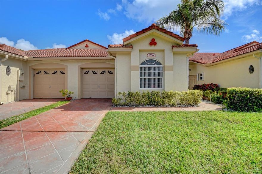 PRICE REDUCTION!! Seller motivated!! All new impact windows and doors complete. Beautiful wood floors. Meticulously kept. Long water views. Home shows like a model home.  Split bedroom floor plan . Beautiful Bruce laminate floors in all the common area and carpet in the 2 bedrooms. Nice light kitchen with large pantry, newer appliances. New high end fixtures and fans though out. Master has separate shower double sinks  soak tub.  Inside laundry room with upgraded Maytag washer and dryer, New beautiful custom verticals window treatments. 6 panel doors. This home is move in ready. Great exposure, beautiful tropical cross breezes.  Clubhouse pool hot tub tennis shuffle board and more!!! You won't want to miss seeing this one.