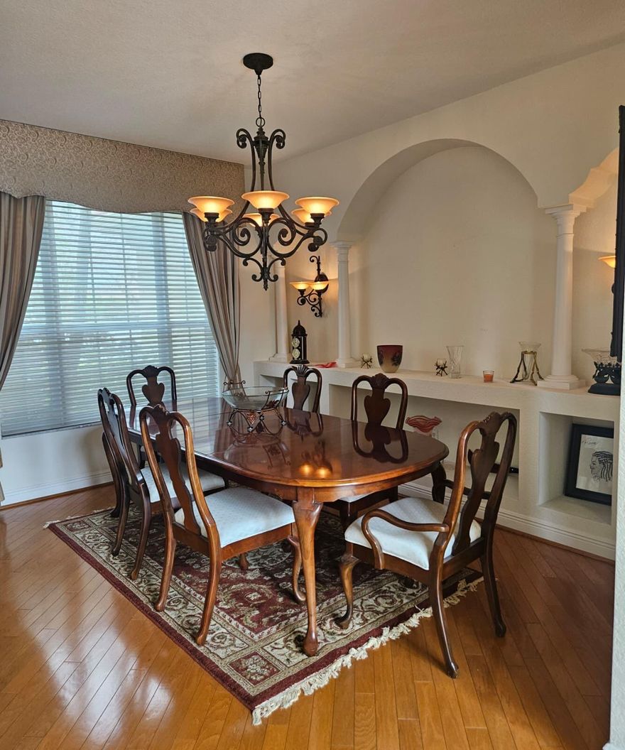 Beautiful 4-bedroom, 4 full-bath home with a spacious layout designed for comfortable everyday living and multi-generational flexibility. This well-kept residence features bright formal and casual living areas, rich wood flooring, a large open kitchen with abundant cabinetry, granite countertops, stainless steel appliances, double ovens, breakfast area, and bar seating for easy entertaining.  The primary bedroom is located upstairs and offers added privacy, while en suite bedroom/bathroom setups provide comfort and convenience. A full bath and flexible bedroom space make this home especially well-suited for an in-law setup, extended family, or guests. Enjoy the balcony, generous indoor living spaces, and beautifully maintained exterior with mature landscaping and great curb appeal.